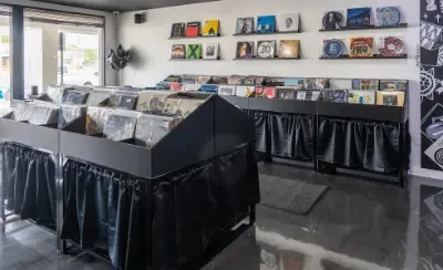 Inside Romeo Records and Cafe Bar with custom bins for records