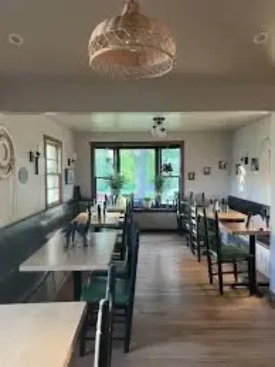 Inside the Moringa Tree with tables and chairs