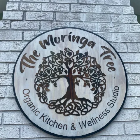 The Moringa Tree logo outside their building