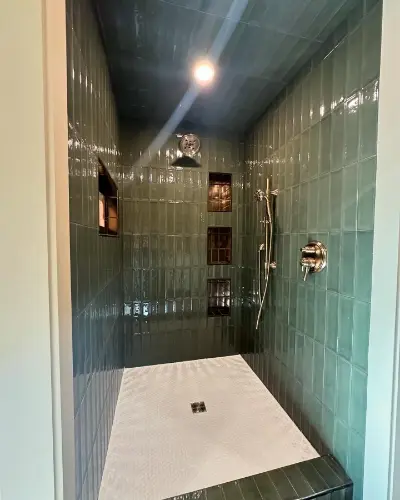 Dark green tiled master walk in shower