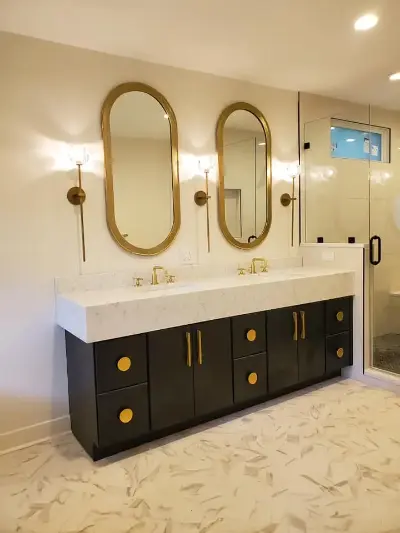Dark brown and white master bathroom with gold accents