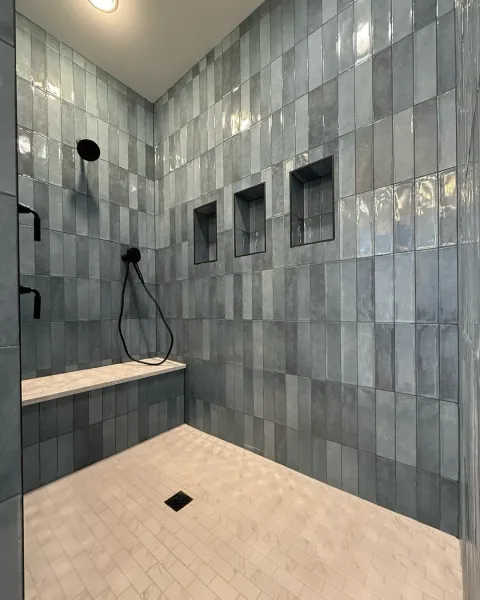 Large walk in shower with a bench
