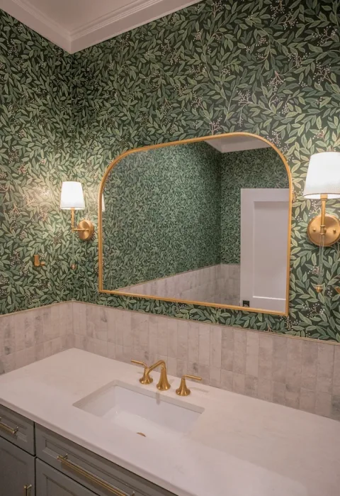 multifamily bathroom with green floral wallpaper