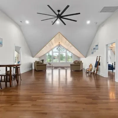 Bonus room with dark wood floors