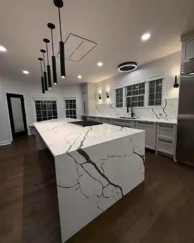 White and Black Vein Marble kitchen with a large matching island