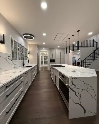 White and Black Vein Marble kitchen with a large matching island