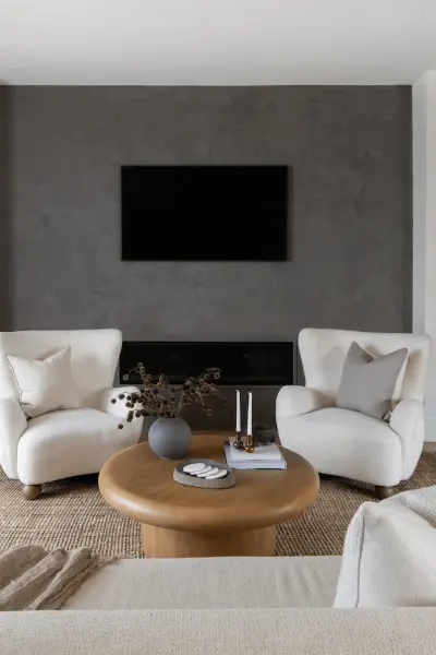Dark Stone modern fireplace with white furniture