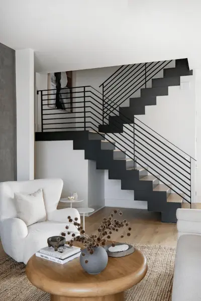 Modern black stairs with metal railings