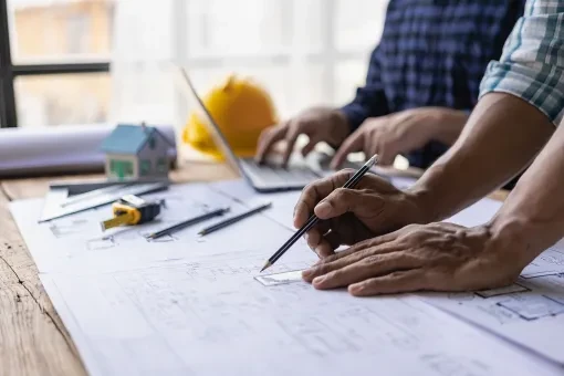 Stellan Eoin Builders reviewing project plans on site